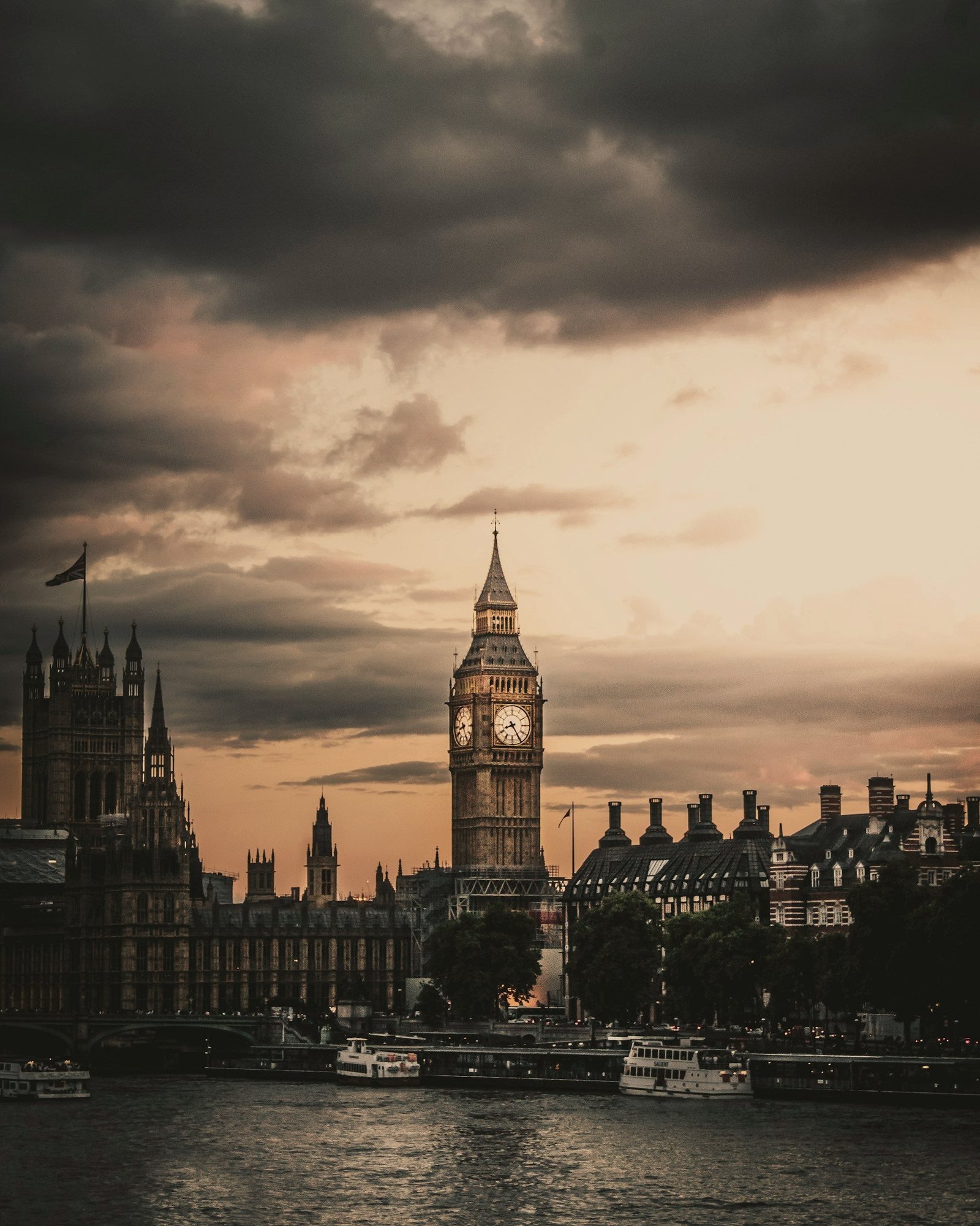Westminster and the Elizabeth Tower at dusk, seen across the Thames