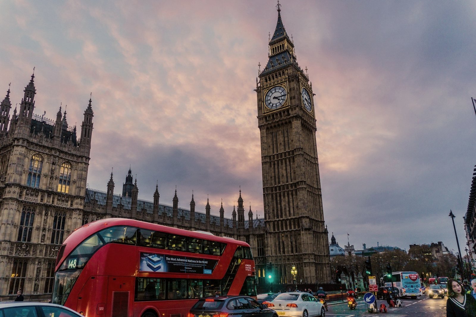 A red double-decker passing the Elizabeth Tower at dusk — notes from the road with P5 Chauffeurs