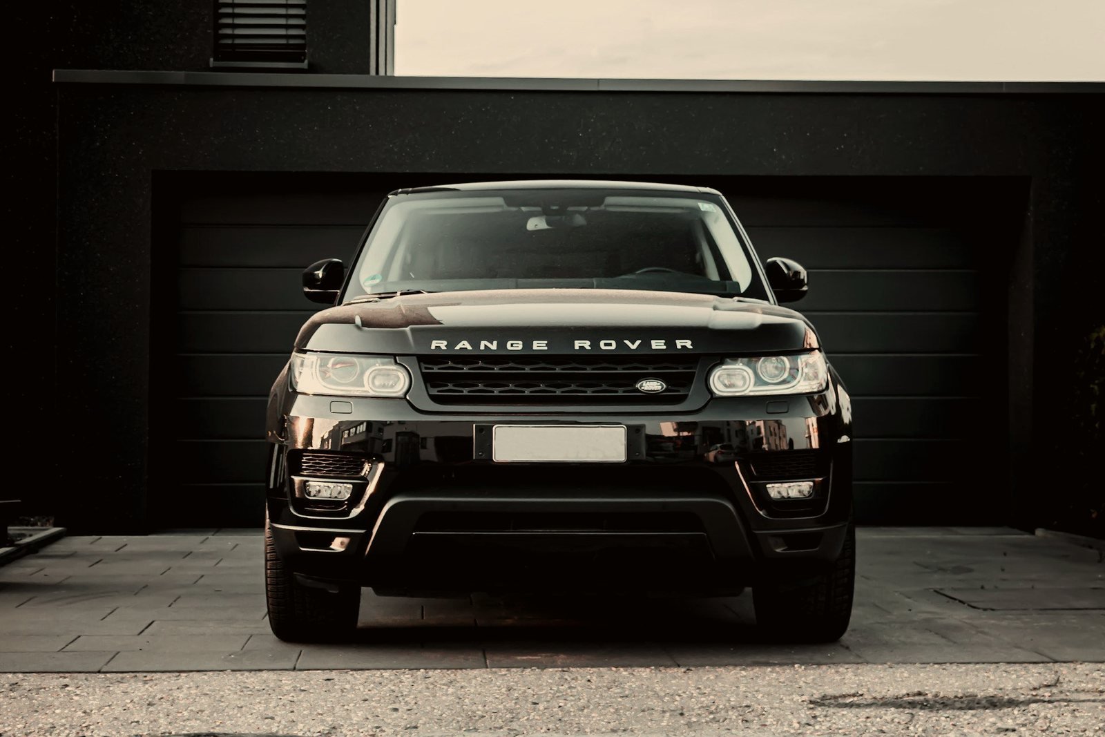 Black luxury SUV waiting outside a private residence — one standard across every P5 chauffeur service